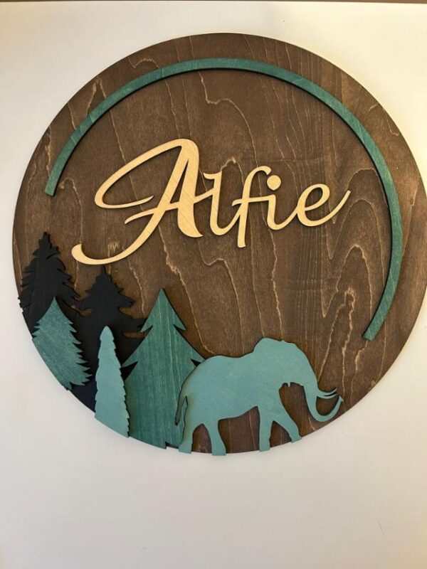 wooden sign for nursery featuring an elephant and babys name